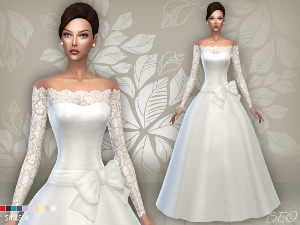Dieses Kleid hat lange Ärmel, die aus Spitze gefertigt sind und in einen geraden Ausschnitt übergehen. Der Rest des Kleides ist ein Ballkleid mit einer großen Schleife um die Taille gebunden.