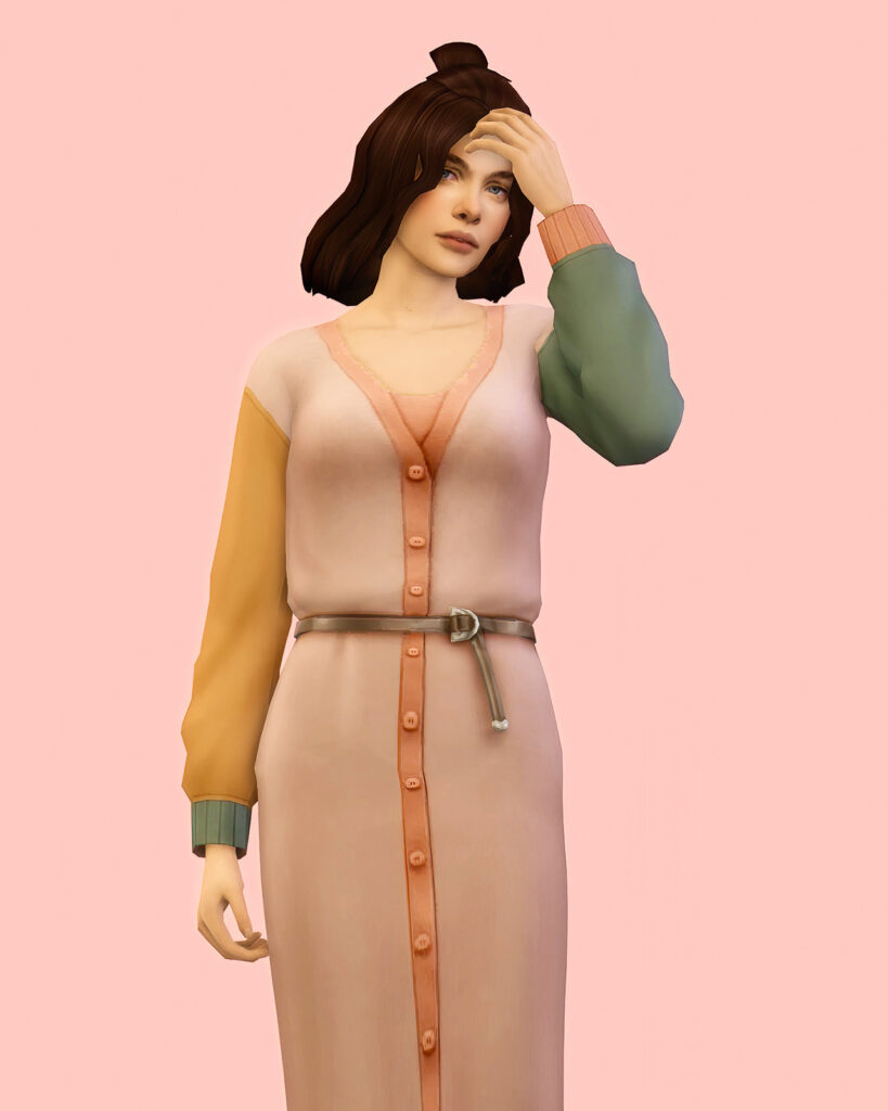Eine Sim mit schulterlangen braunen Haaren, die einen Cardigan-Pullover mit Farbblock trägt.