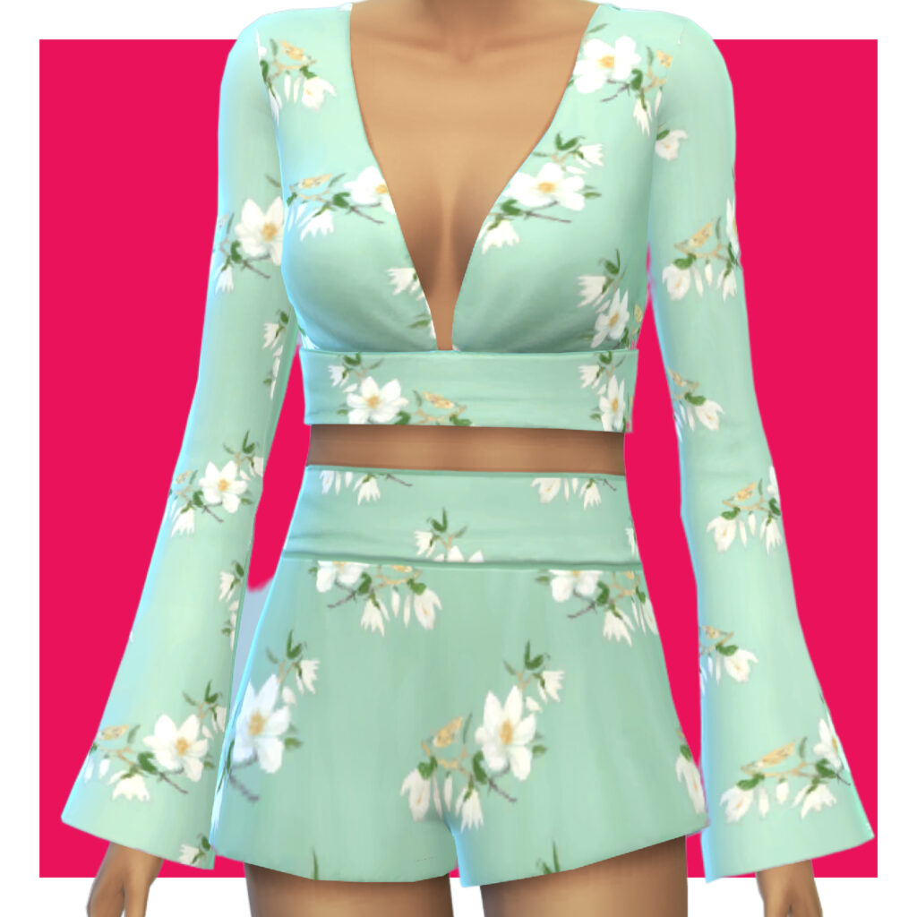 Ein Sim auf einem rosa Hintergrund, der ein zweiteiliges Set trägt, das in einer türkisfarbenen Farbe mit einem floralen Muster ist.