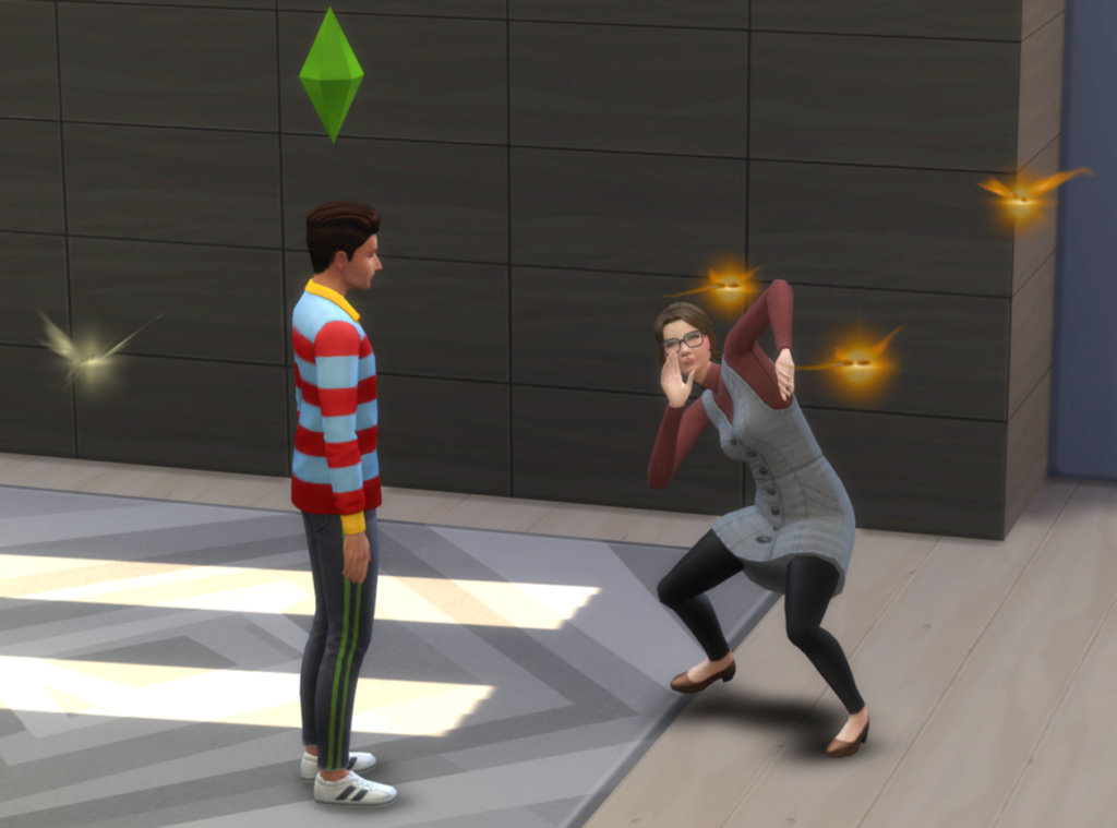 Ein Bild eines männlichen Sims, der einen Sprite-Angriff auf einen weiblichen Sim ausführt, der Angst hat
