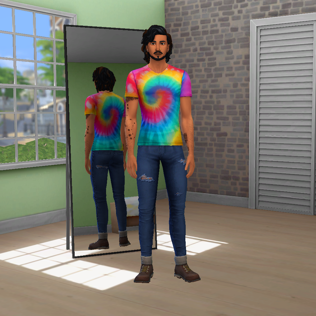 Ein Charakter in Die Sims 4 steht in einer Umkleidekabine und trägt ein CC-Tie-Dye-Hemd und zerrissene Jeans.