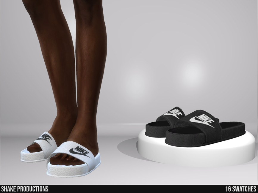 Ein Paar nackte Beine mit weißen Nike-Slides