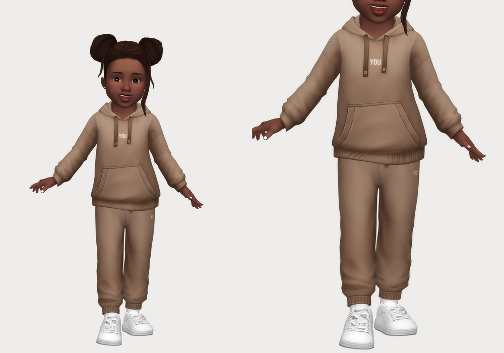 Ein Sim trägt ein Jogger-Set in Braun mit weißen Schuhen