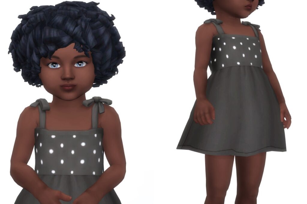 Ein Kleinkind aus Die Sims 4 mit lockigem Haar trägt ein schwarzes Kleid mit weißen Punkten oben.